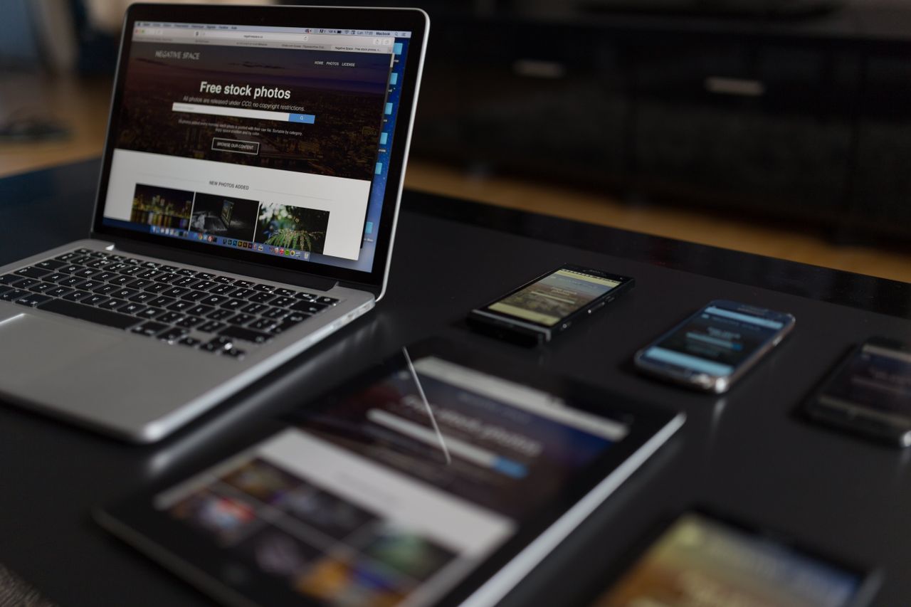A modern workspace presenting a laptop, tablet, and smartphones, well suited for tech and freelance use.